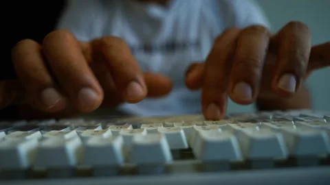 Hands typing on computer keyboard, Close-up of hands typing on a white comp.. Stock Footage 346459789