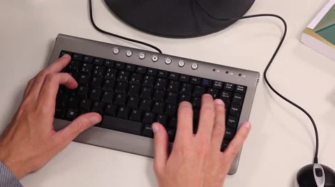 Hands typing on a computer keyboard Stock Footage 46531315