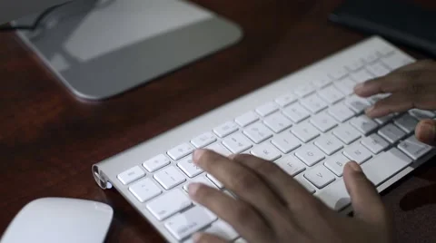 Hands typing on computer keyboard Stock Footage 49677019
