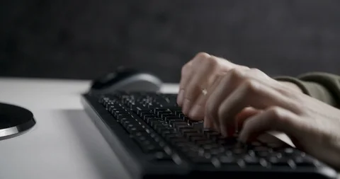 Hands typing on a computer keyboard Vídeo Stock 104608194