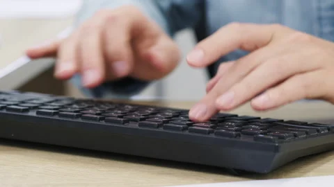 Hands Typing on Computer Keyboard Stock Footage 322920782