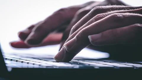 Hands typing on the computer keyboard. Modern style Stock Photos