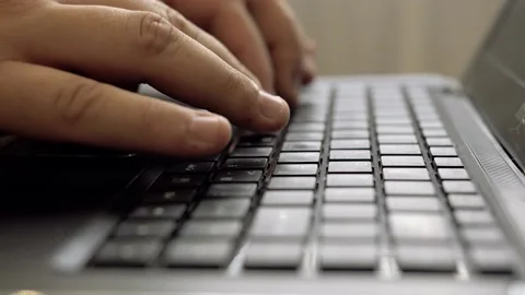 Hands typing on computer keyboard, moving camera, business man working on laptop Stock Footage 159994475