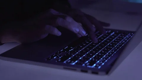 Hands typing on computer keyboard in the night Stock Footage 81054833