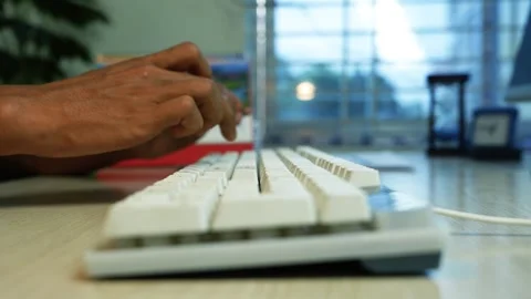 Hands Typing on Computer Keyboard at Office Desk, Close-up of hands typing .. Stock Footage 346483874