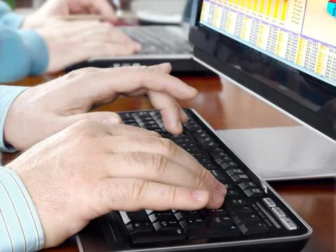 Hands typing on computer keyboard Stock Photos