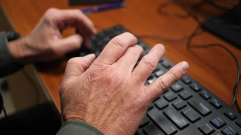Hands Typing on a Computer Keyboard While Working Vídeo Stock 345205127