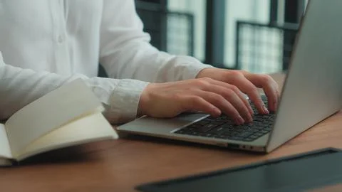 Hands typing computer laptop programming at workplace notebook planning business Foto stock