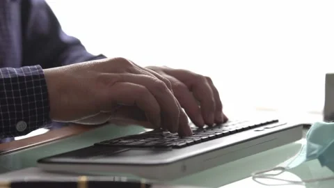 Hands typing on computer with white background Stock Footage 143798490