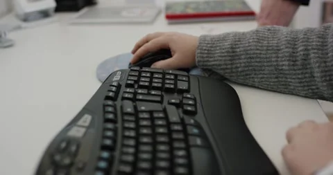 Hands Typing on Ergonomic Keyboard and Mouse, White Office Desk, Close-Up Shot Видео 341314608