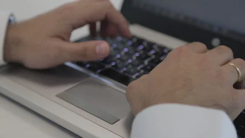 Hands typing fast on laptop computer Stock Footage 138037264