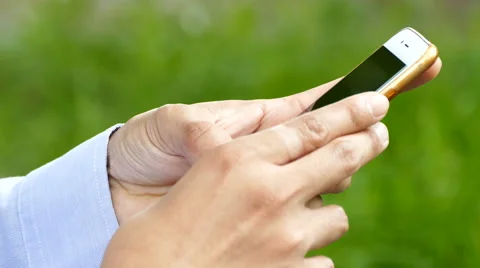 Hands typing fast text messages on smart phone Stock Footage 65807906