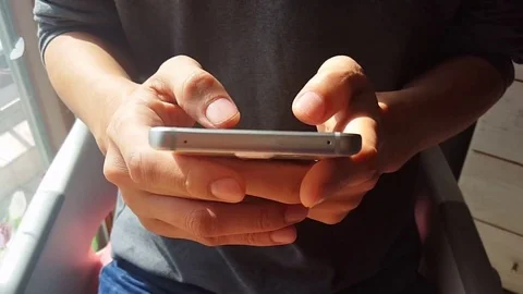 Hands typing fast text messages on smart phone Stock Footage 72782282