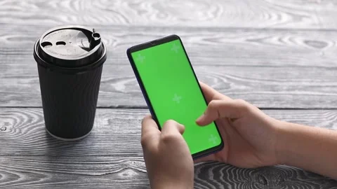 Hands typing on green screen phone Stock-Footage 193968805