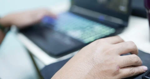 Hands typing on keyboard and clicking a computer mouse Stock Footage 172184137