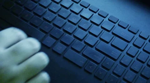 Hands typing on keyboard in blue light Stock Footage 66697309