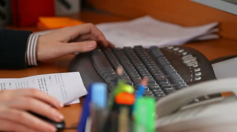 Hands typing on a keyboard, to correct Stock Footage 30619769