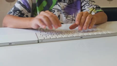 Hands typing on keyboard at desk working on computer, remote work or office Stock Footage 333471256