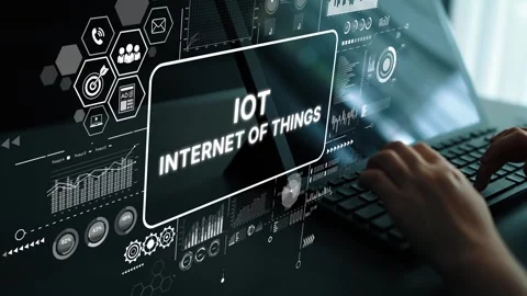 Hands Typing on Keyboard with Digital Interface Displaying Internet of Things Stock Footage 310332556
