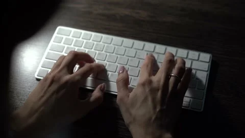 Hands typing keyboard in evening. Concept of human and technology and business Stock Footage 144100457