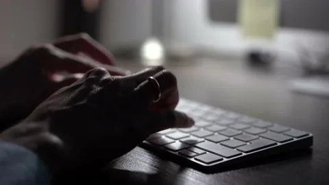 Hands typing keyboard in evening. Concept of human and technology and business 動画素材 144100479