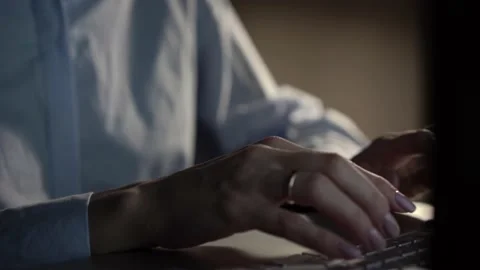 Hands typing keyboard in evening. Concept of human and technology and business Stock Footage 144100536