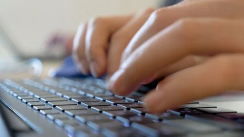 Hands typing on keyboard. Hands typing on a laptop keyboard. Work force Stock Footage 121532164
