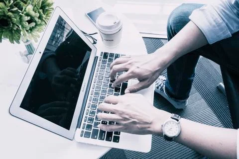 Hands typing keyboard on laptop Foto stock
