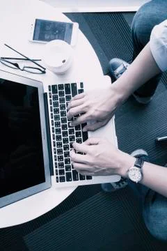 Hands typing keyboard on laptop Stock Photos