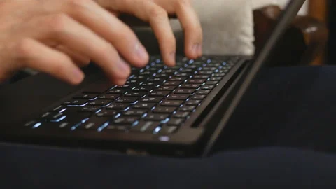 Hands typing on the keyboard. The man is typing Stock Footage 104812703