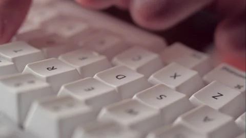Hands typing keyboard at night time Stock Footage 143125419