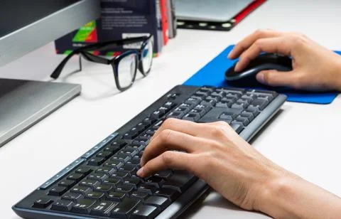 Hands typing on keyboard Stock Photos