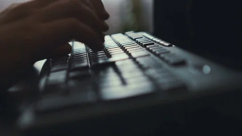 Hands typing on keyboard. Window background lighting. Close-up Stock Footage 72053556