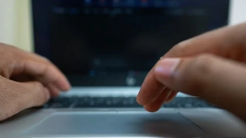 Hands Typing on Laptop with Blurred Screen Stock Footage 317737483