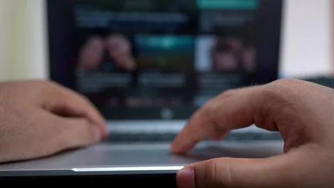 Hands Typing on Laptop with Blurred Screen Stock Footage 317737488