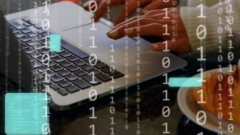 Hands typing on laptop, causing binary UI scrolls, brief croissant reach, Stock Footage 334703714