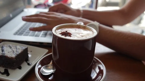 Hands Typing on Laptop with Coffee Cup on Table Stock Footage 70723175