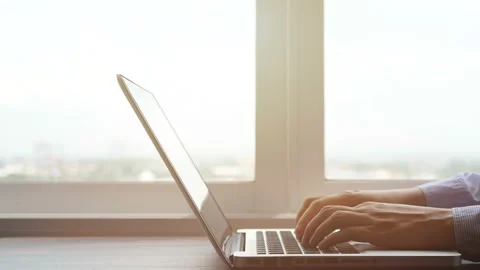 Hands typing on laptop computer keyboard, pan camera. Stock Footage 133485209