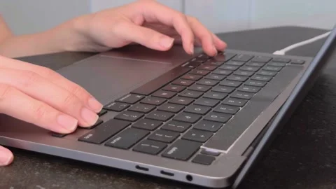 Hands Typing on Laptop Computer Keyboard Close-Up for Business and Remote Work Stock Footage 337153034