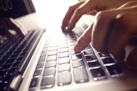 Hands typing on laptop computer Stock Photos