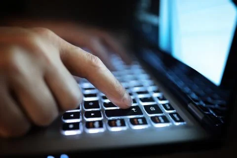 Hands typing on laptop computer Stock Photos