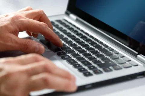 Hands typing on laptop computer Stock Photos