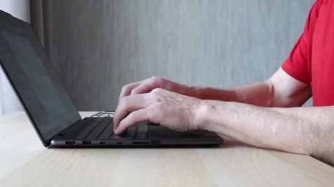 Hands typing on laptop computer, senior man using technology Stock Footage 241231362