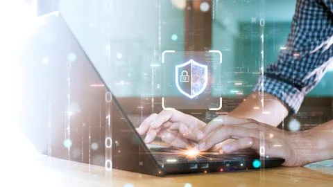 Hands typing on a laptop with a digital shield and lock icon, symbolizing c.. Stock-Fotos