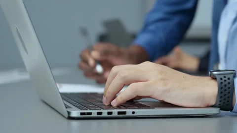 Hands typing on laptop during office work Stock Footage 288119375