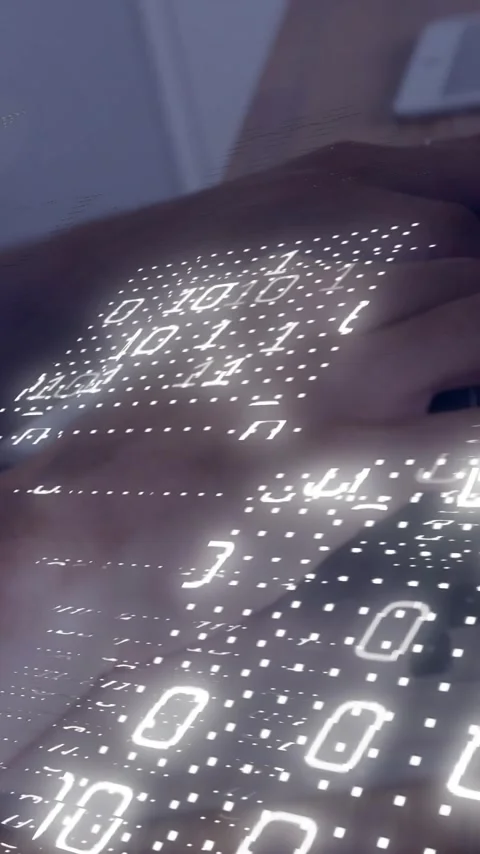 Hands typing on laptop keyboard with binary code animation overlay Stock Footage 319617579