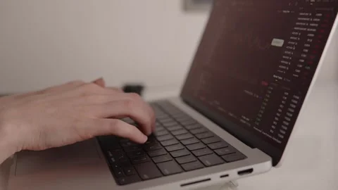 Hands typing on laptop keyboard with cryptocurrency trading platform open Stock Footage 317952320