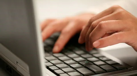 Hands typing on a laptop keyboard Stock Footage 863112
