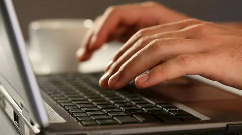 Hands typing on a laptop keyboard Stock Footage 864082