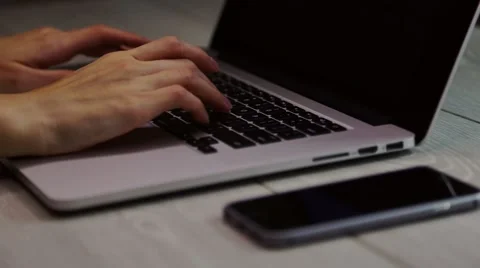 Hands typing on laptop keyboard Video stock 68606378